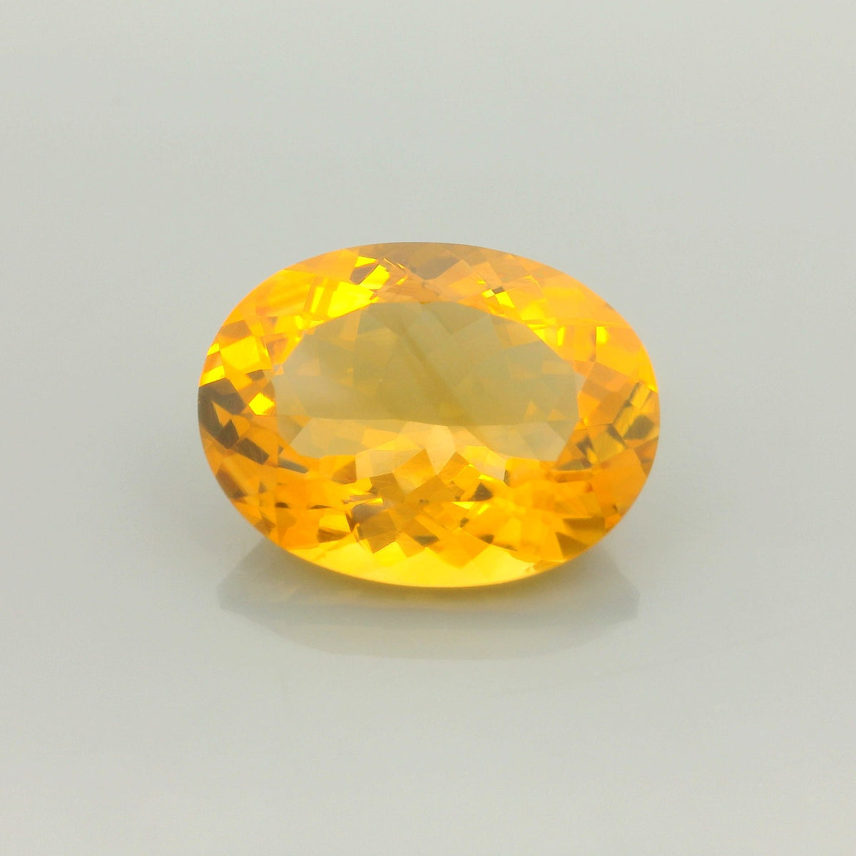 16.5ct Orangy Yellow/Medium Intense Yellow Oval Citrine