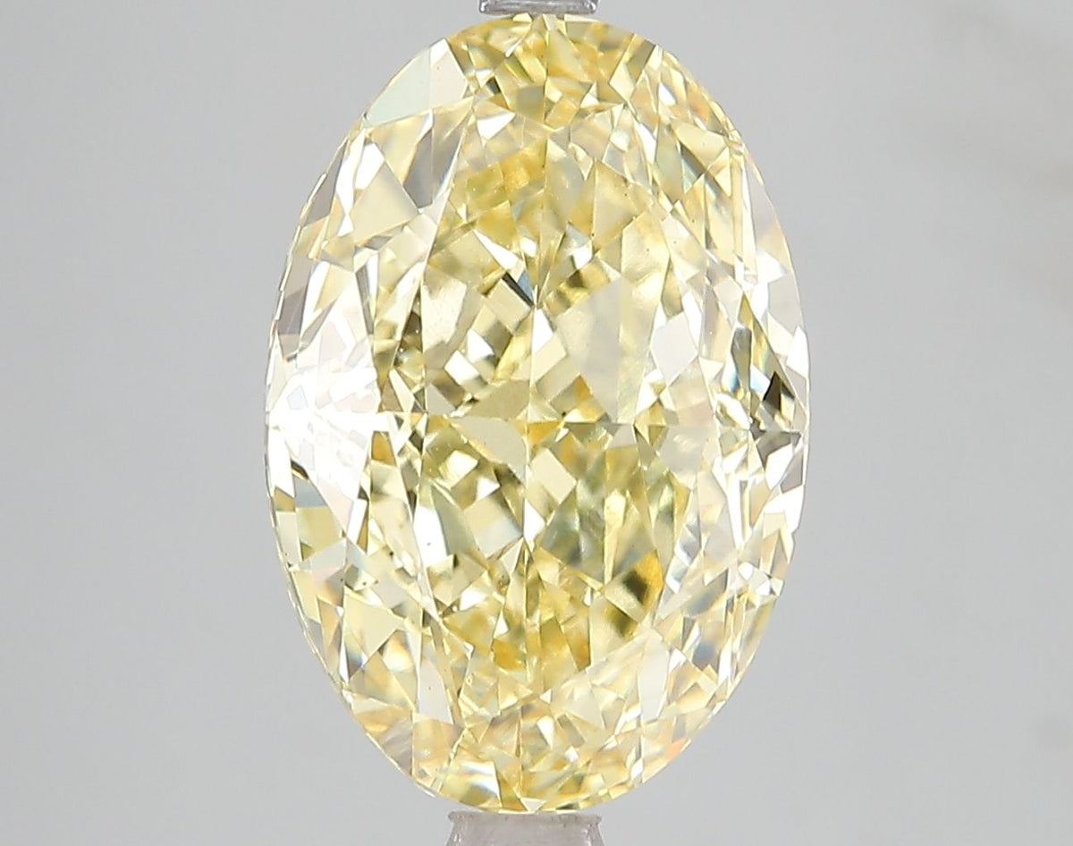 Lab-Grown Oval Diamond - 6.02 Carats, Fancy Vivid Yellow Color, VS2 Clarity - Certified by IGI - Report Number: LG671478728