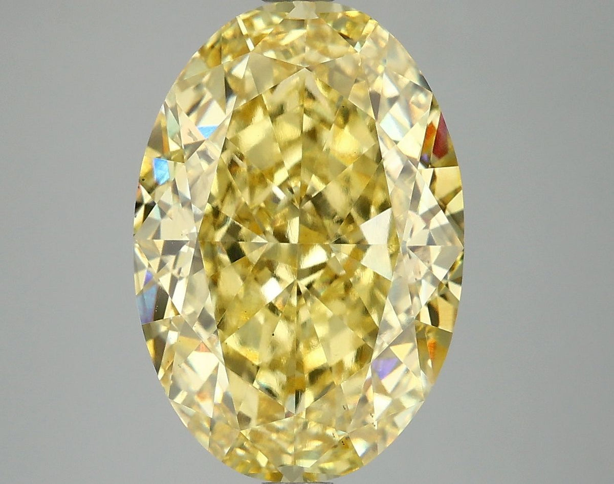 Lab-Grown Oval Diamond - 7.19 Carats, Fancy Vivid Yellow Color, VS2 Clarity - Certified by IGI - Report Number: LG674521368