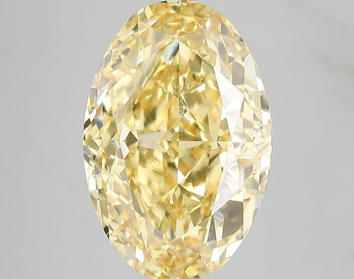 Lab-Grown Oval Diamond - 7.05 Carats, Fancy Vivid Yellow Color, VS1 Clarity - Certified by IGI - Report Number: LG671478730