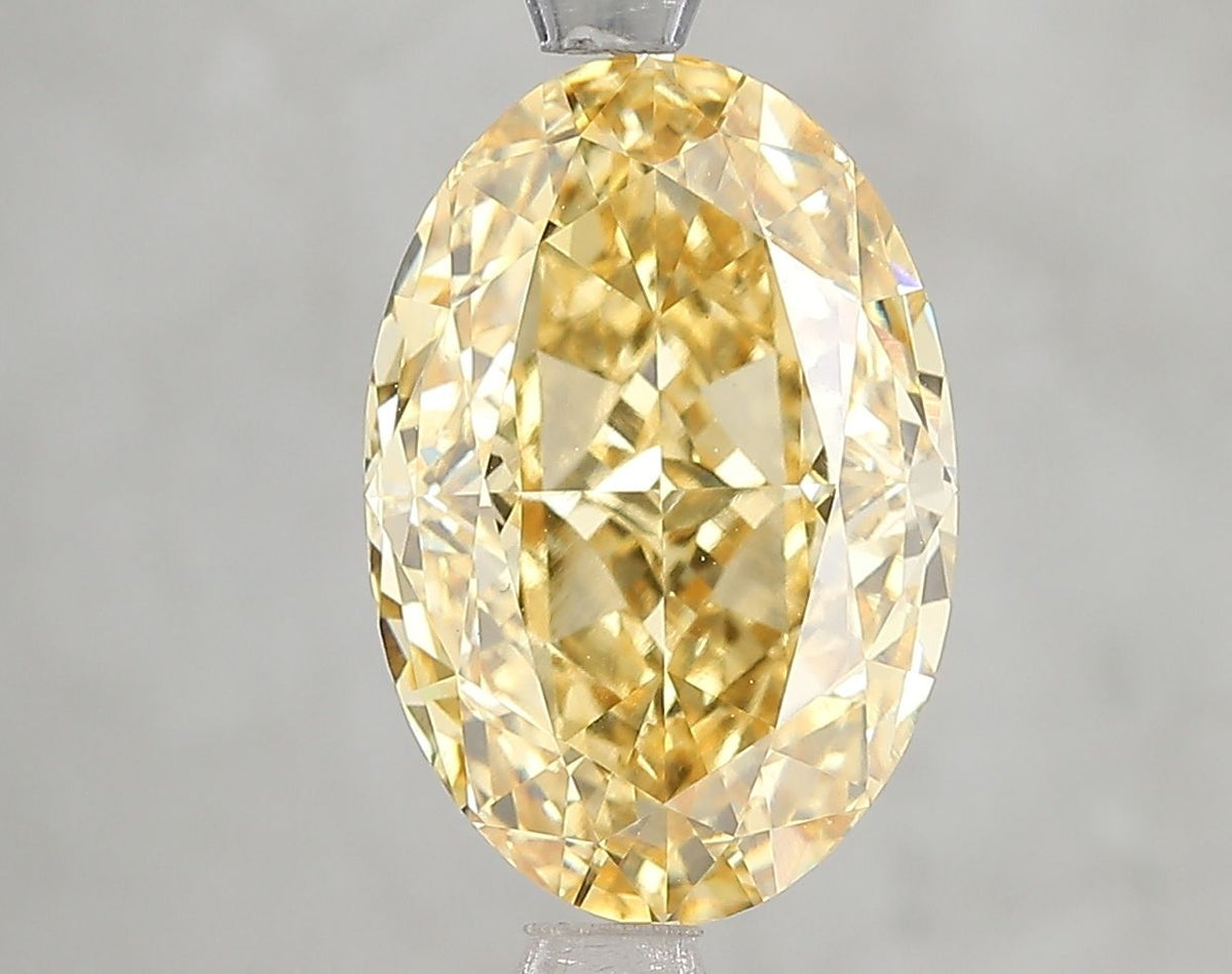 Lab-Grown Oval Diamond - 4.68 Carats, Fancy Vivid Yellow Color, VVS2 Clarity - Certified by IGI - Report Number: LG666432400