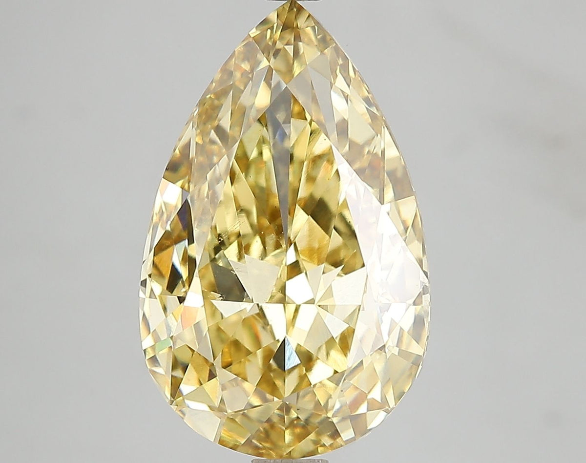 Lab-Grown Pear Diamond - 7.09 Carats, Fancy Vivid Yellow Color, VS1 Clarity - Certified by IGI - Report Number: LG671478723