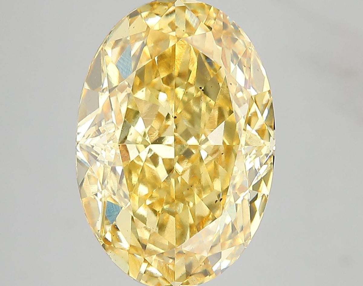 Lab-Grown Oval Diamond - 7.07 Carats, Fancy Vivid Yellow Color, VS2 Clarity - Certified by IGI - Report Number: LG671478720