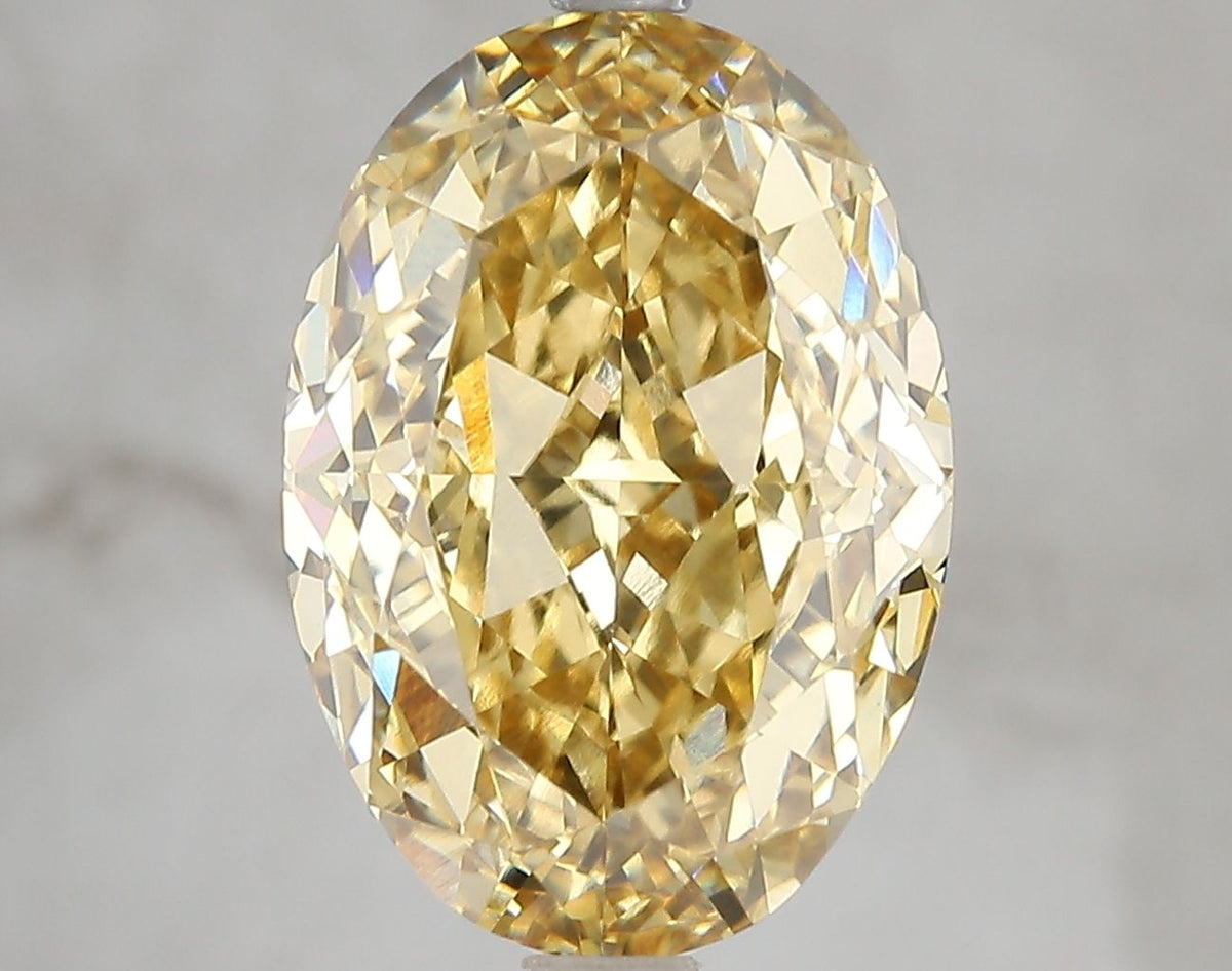 Lab-Grown Oval Diamond - 7.05 Carats, Fancy Vivid Yellow Color, VS1 Clarity - Certified by IGI - Report Number: LG671478731